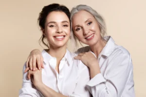 Two smiling women showing results of BHRT therapy.